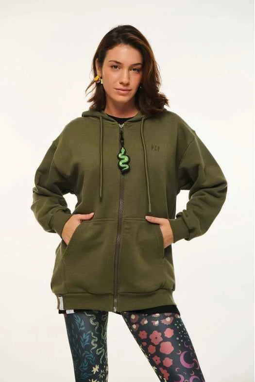 Person wearing an olive green hoodie with a brand logo on a white background