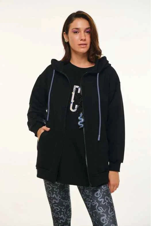 Person wearing a black hoodie with a carabiner on a white background