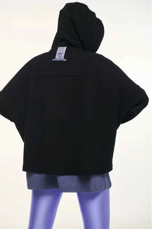 Black hooded jacket with a visible brand label on a white background