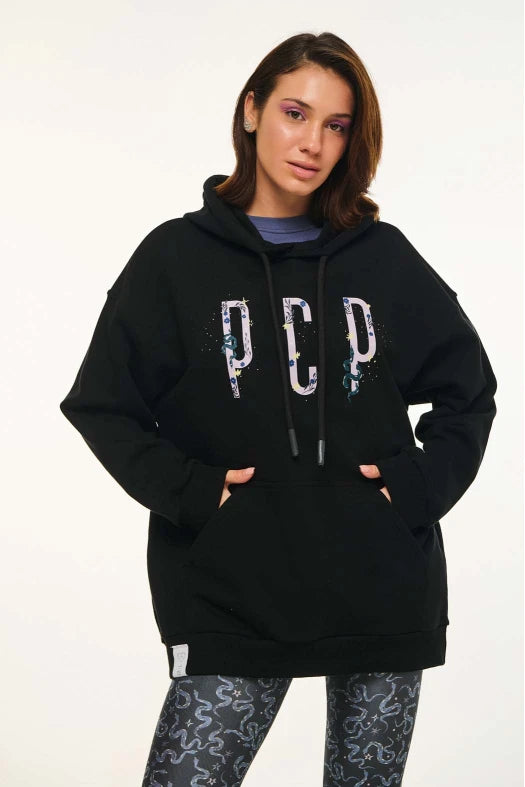 Person wearing a black hoodie with 'PCP' text on a white background