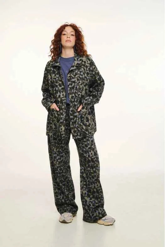 Person wearing a patterned outfit on a white background