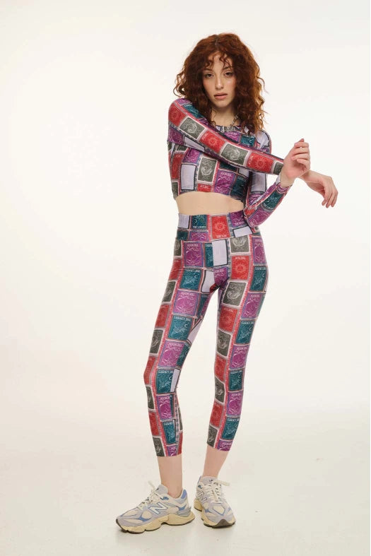 Person wearing a colorful patterned outfit on a white background