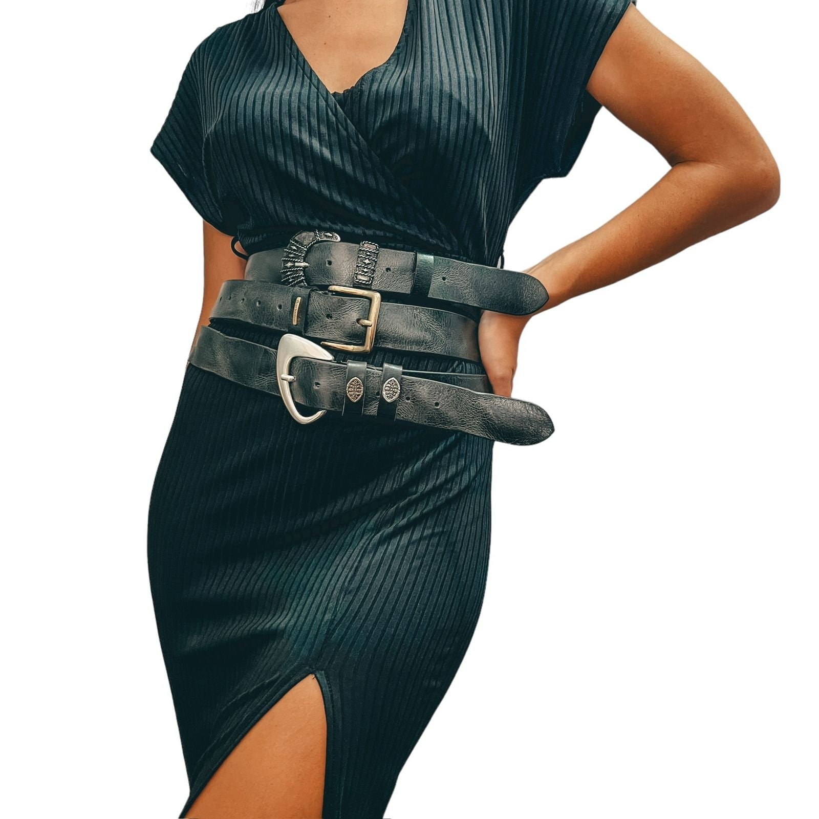 Person wearing a black dress with a wide belt on a white background