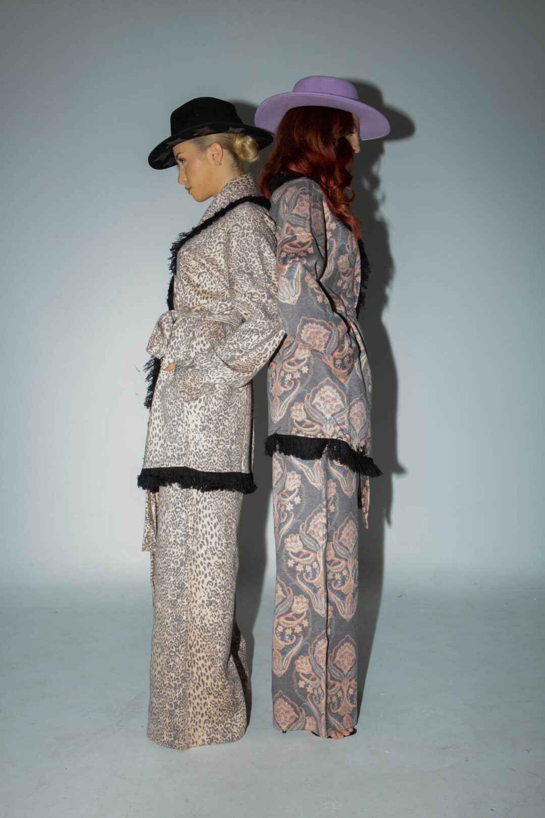 Knitted leopard print jacket with black fringes.