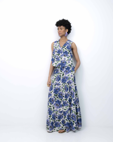Woman wearing a floral dress against a white background