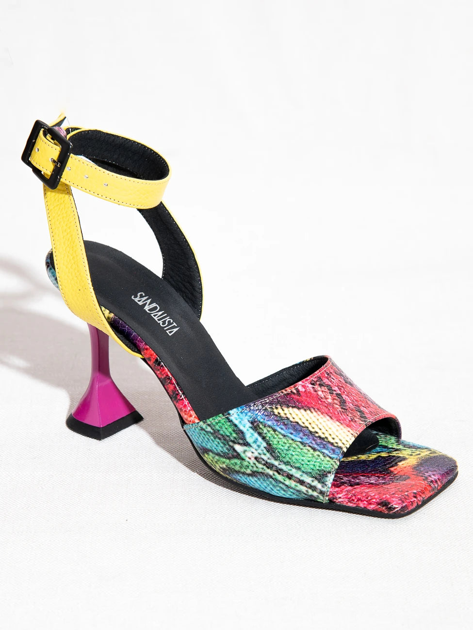 Multicolored sandal with a high heel on a white background