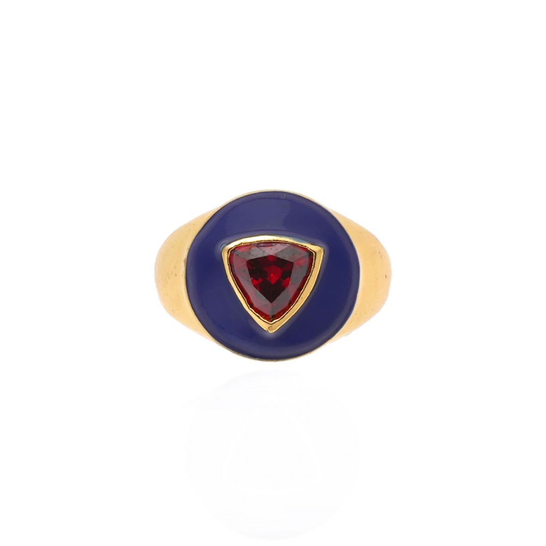 Gold ring with a red gemstone on a white background