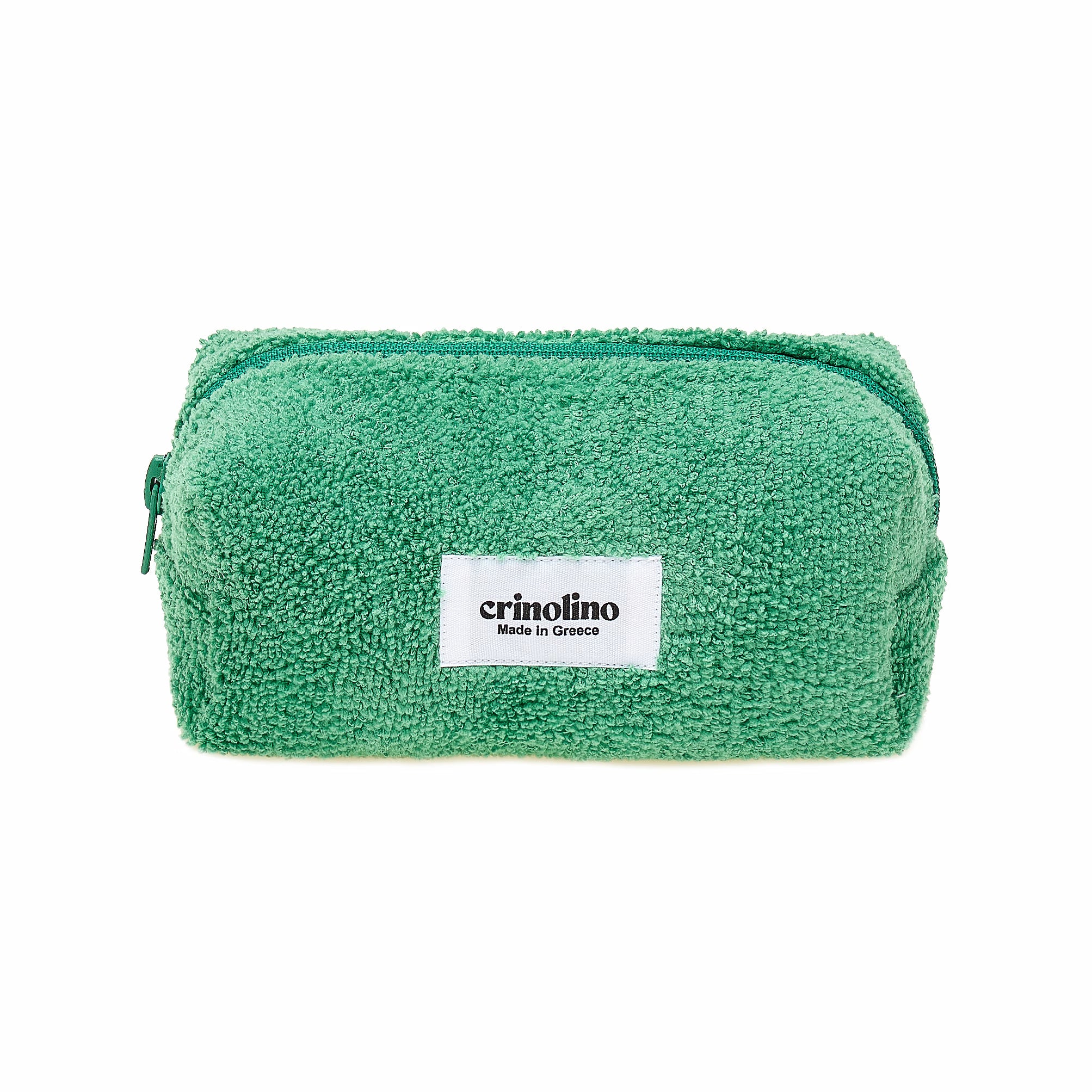 Green towel with a white label on a white background