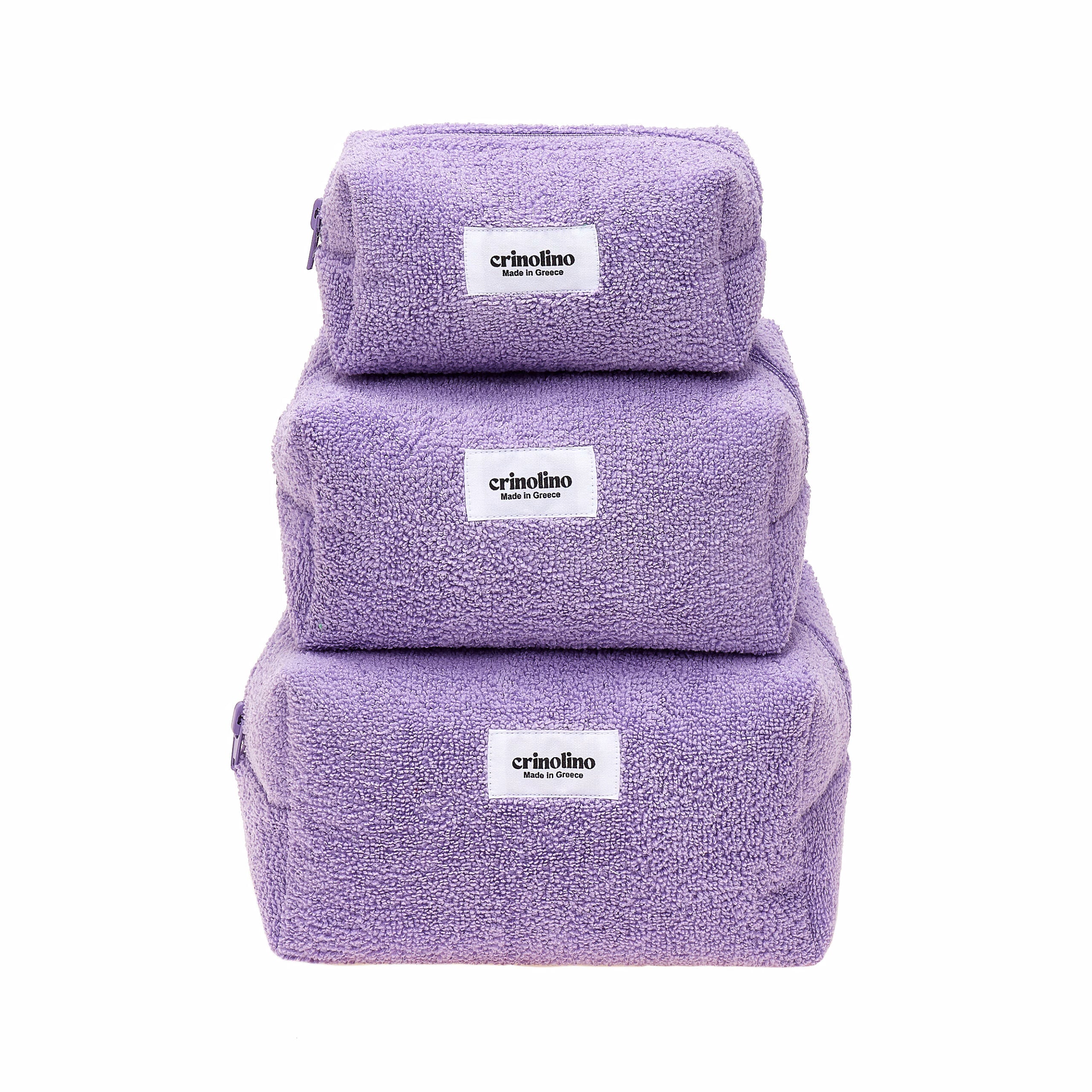 Three purple towels stacked on a white background with 'crinolino' branding.