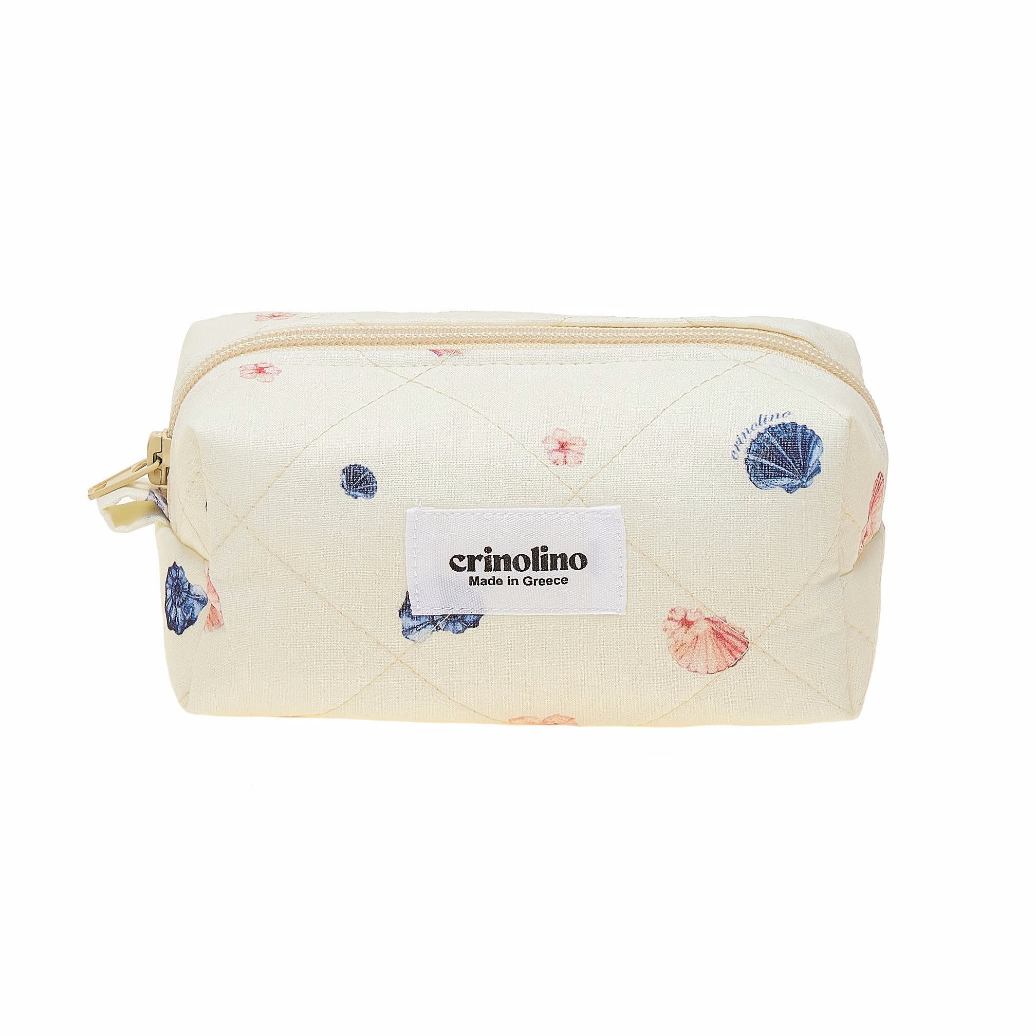 Quilted pouch with shell pattern and crinolino label on a white background