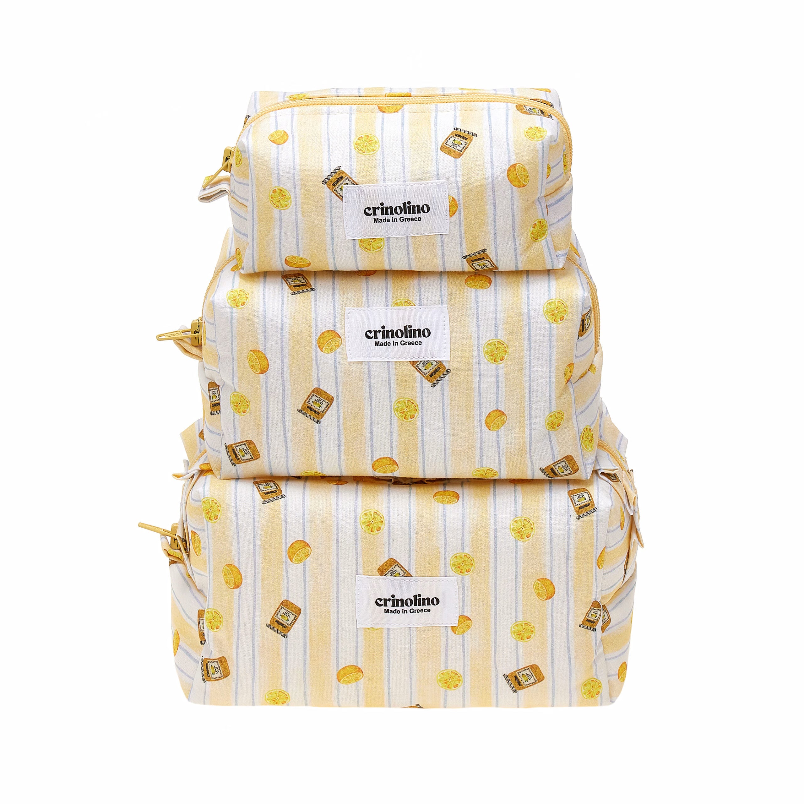 Three stacked backpacks with yellow and white pattern on a white background