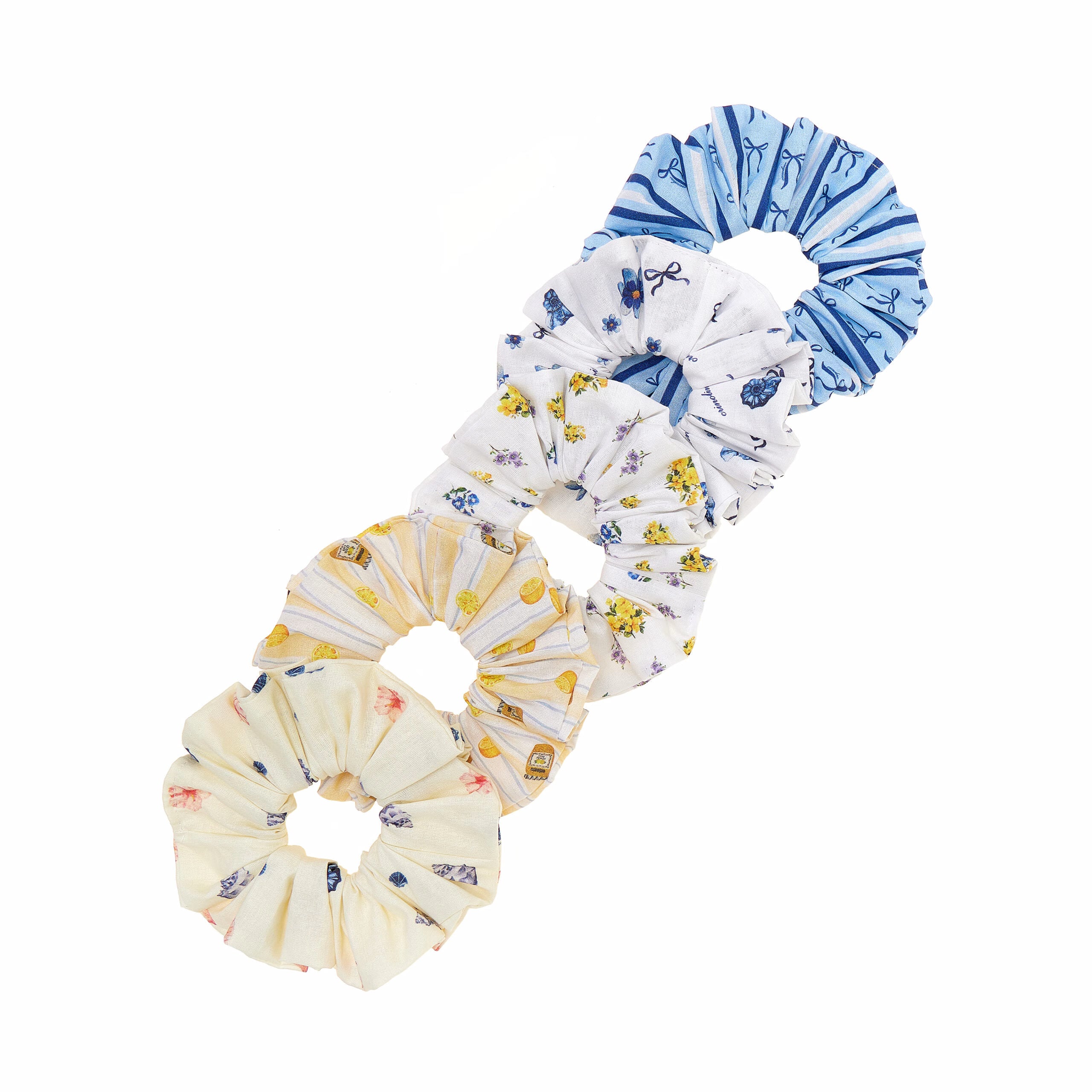 Set of three floral-patterned scrunchies on a white background