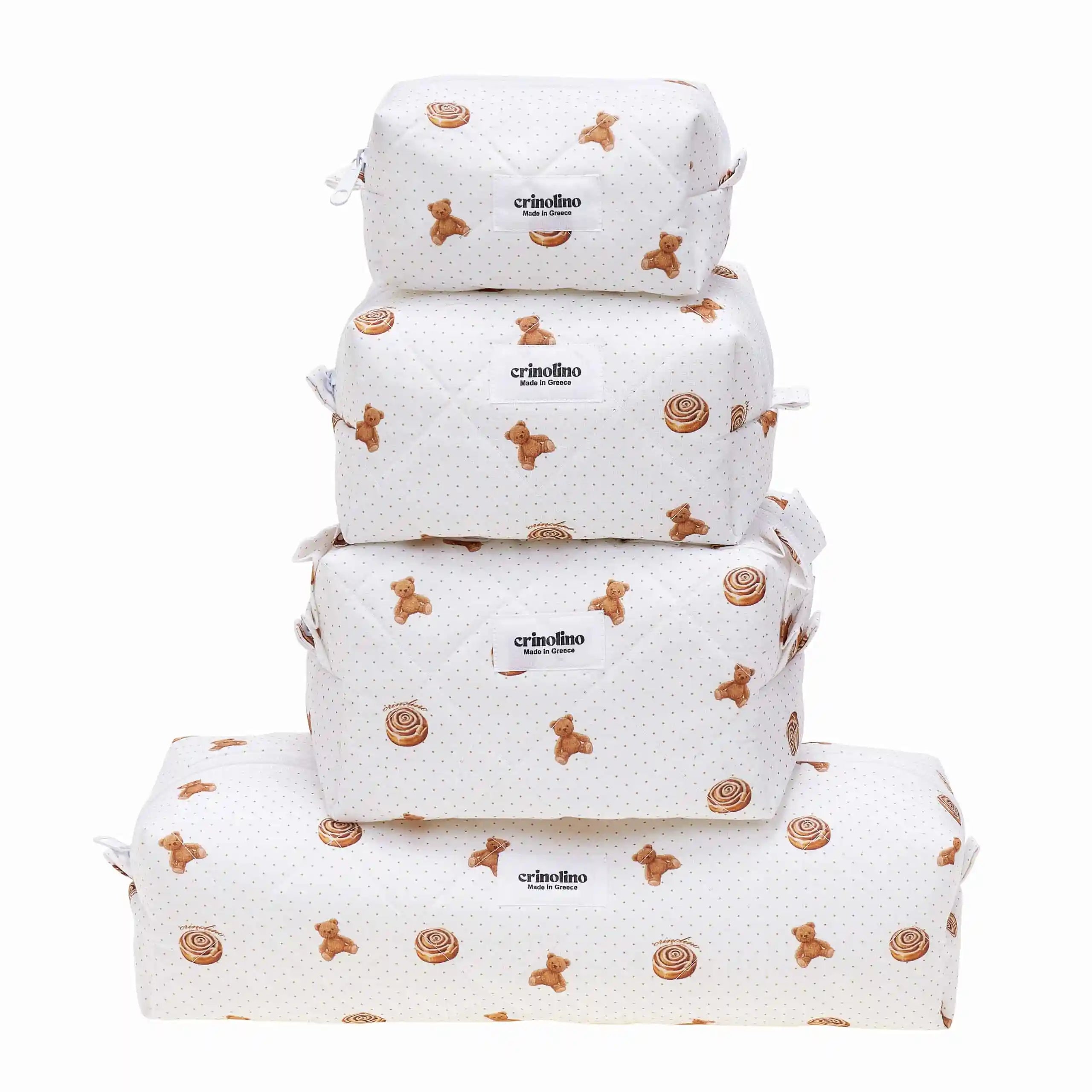 Set of four white bags with brown patterns and 'criollino' branding on a white background