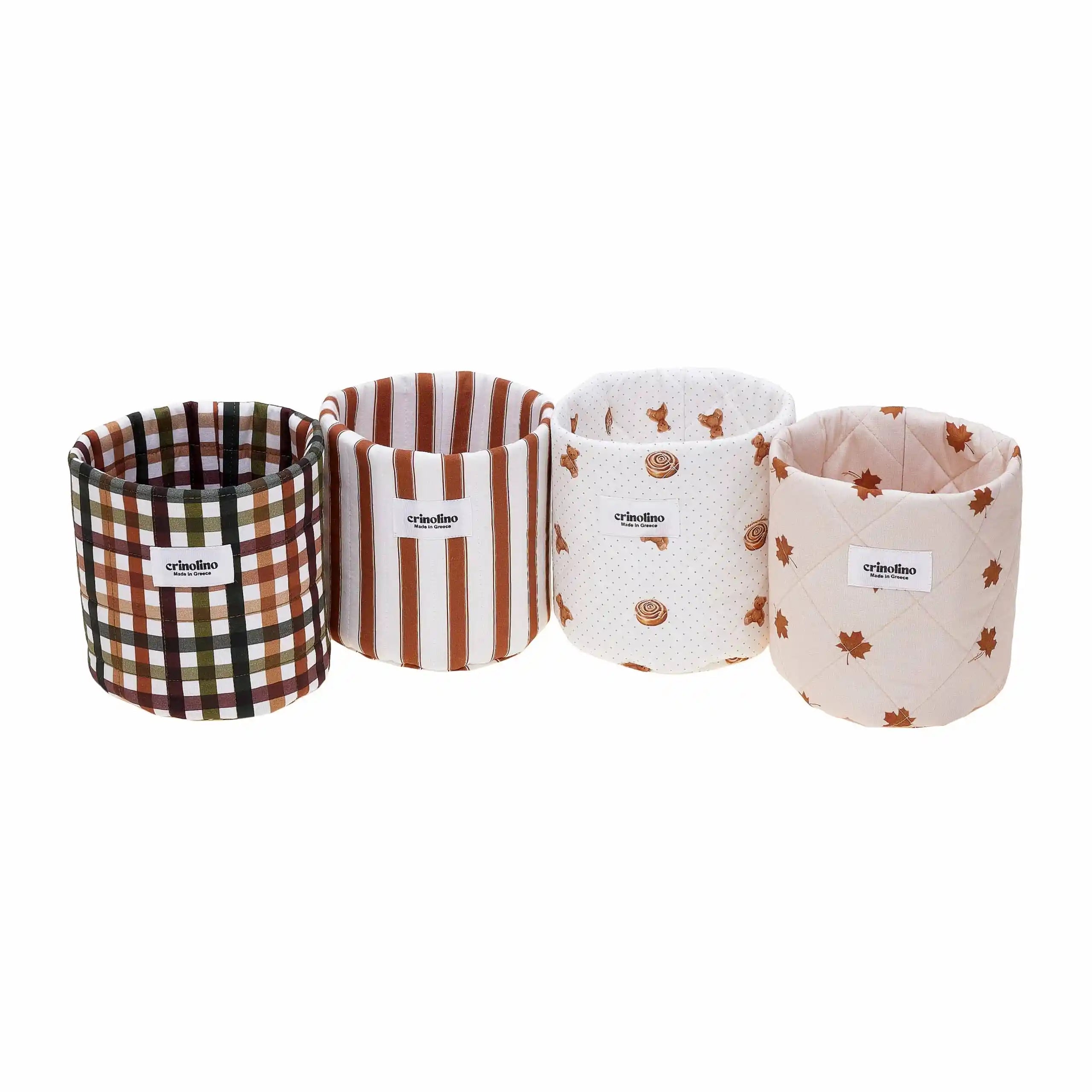 Four fabric containers with different patterns on a white background