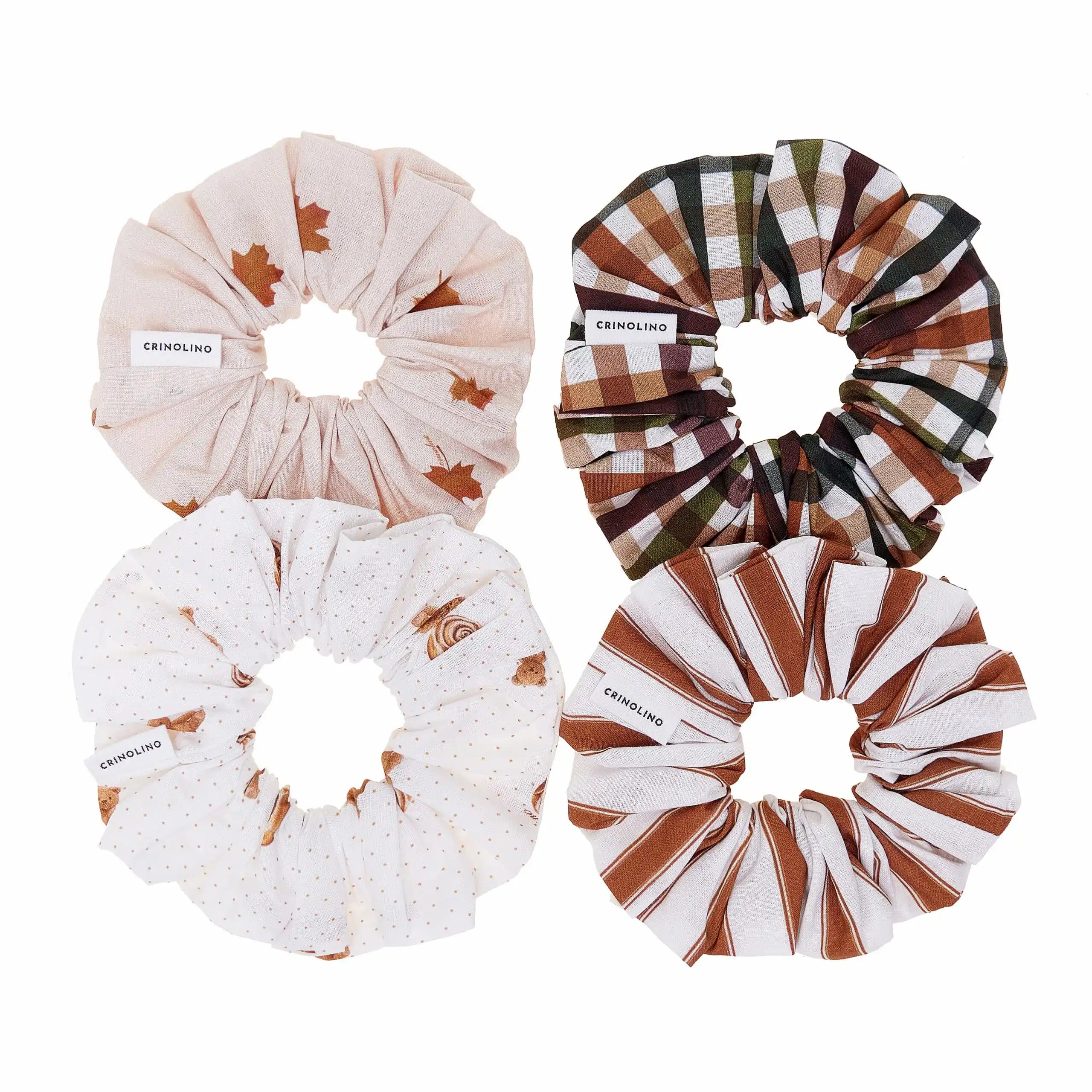 Four scrunchies with different patterns on a white background