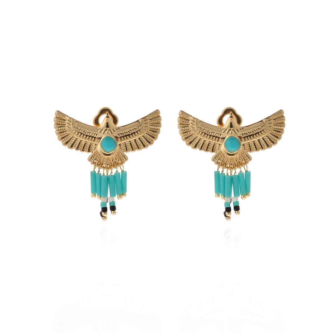 Pair of gold winged earrings with turquoise beads on a white background