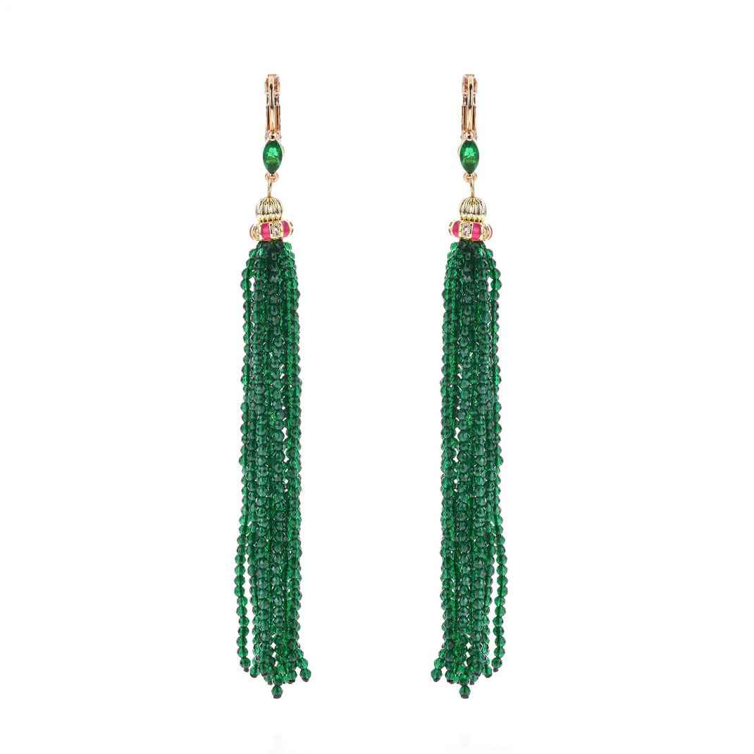 Pair of green beaded tassel earrings on a white background
