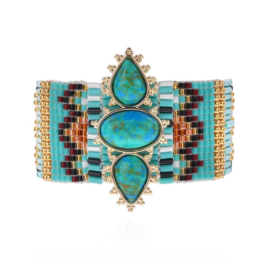 Multicolored beaded bracelet with turquoise stones on a white background