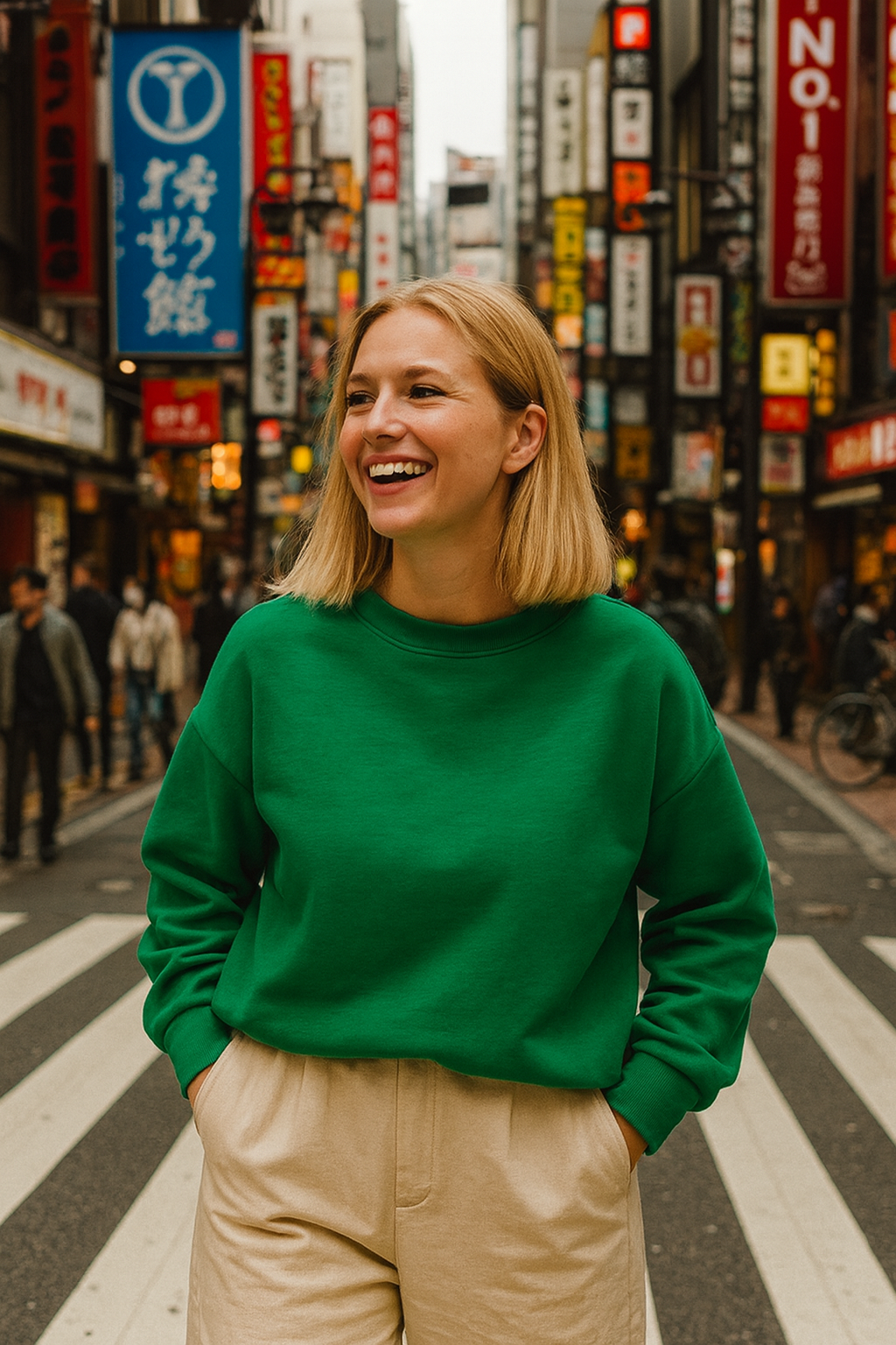 Woman in a green sweater standing on a busy street with colorful signs in the background