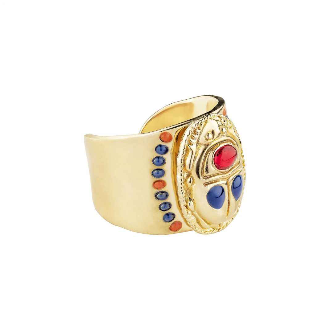 Gold ring with colorful gemstones on a white background