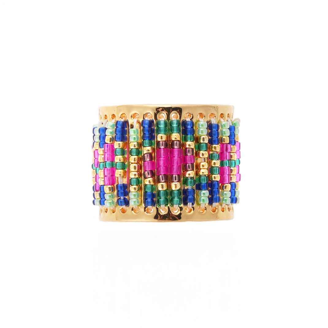Colorful beaded cuff bracelet on a white background