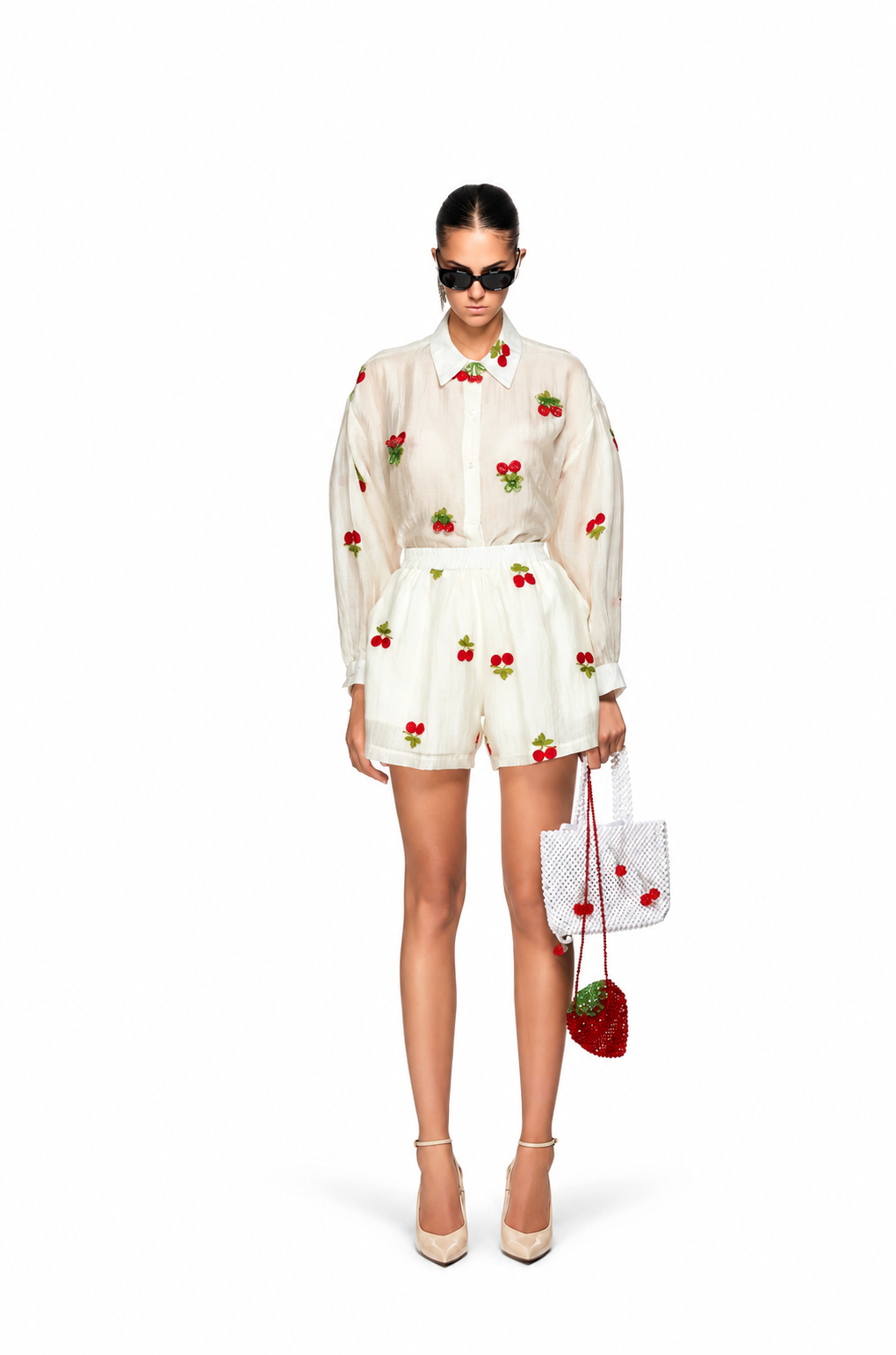 Oui, Odile Beatrice ivory button-up shirt with red cherry motifs and long sleeves, worn with matching shorts