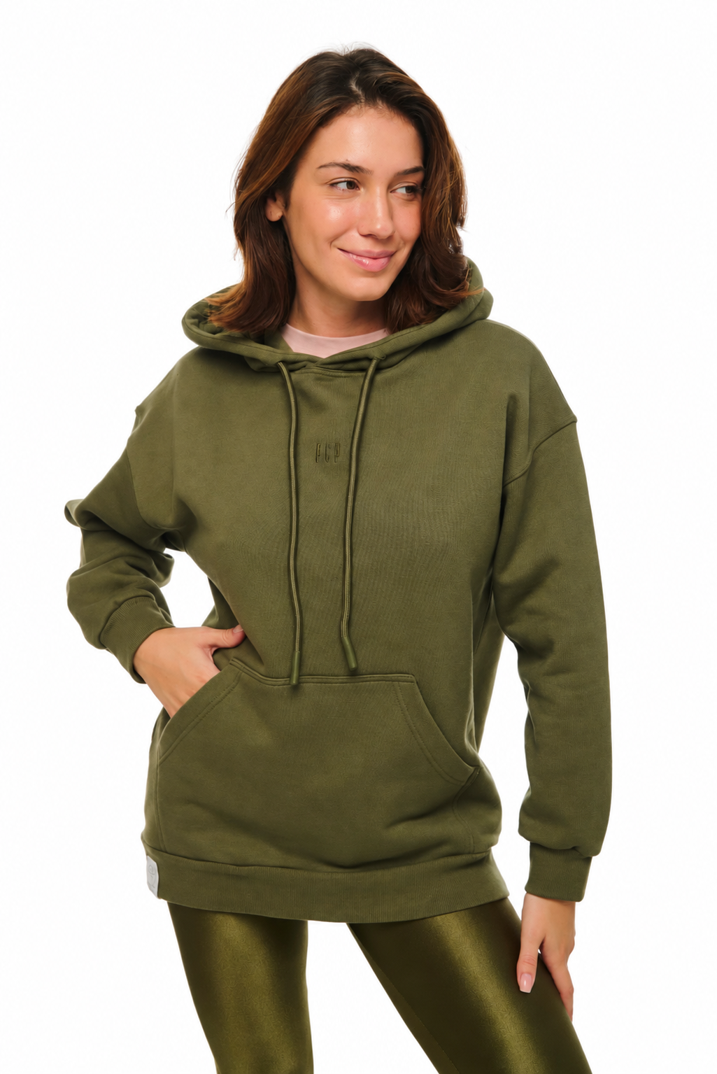 A woman wearing an olive green ribbed pullover hoodie with a drawstring hood and kangaroo pocket, paired with matching olive green leggings, against a plain white background.