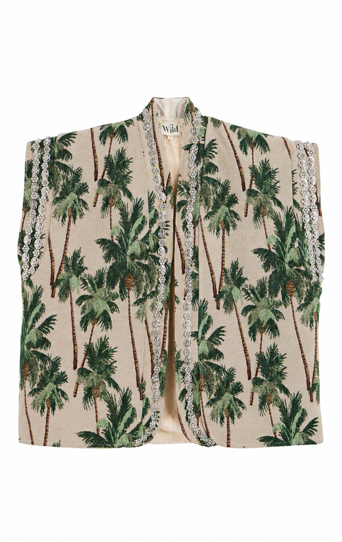 A sleeveless beige vest featuring a green palm tree print and white lace trim along the edges, displayed flat against a white background.