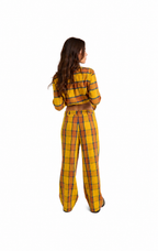 A woman viewed from behind wearing a matching yellow plaid two-piece outfit with a cropped long-sleeve top and wide-leg pants, on a plain white background.
