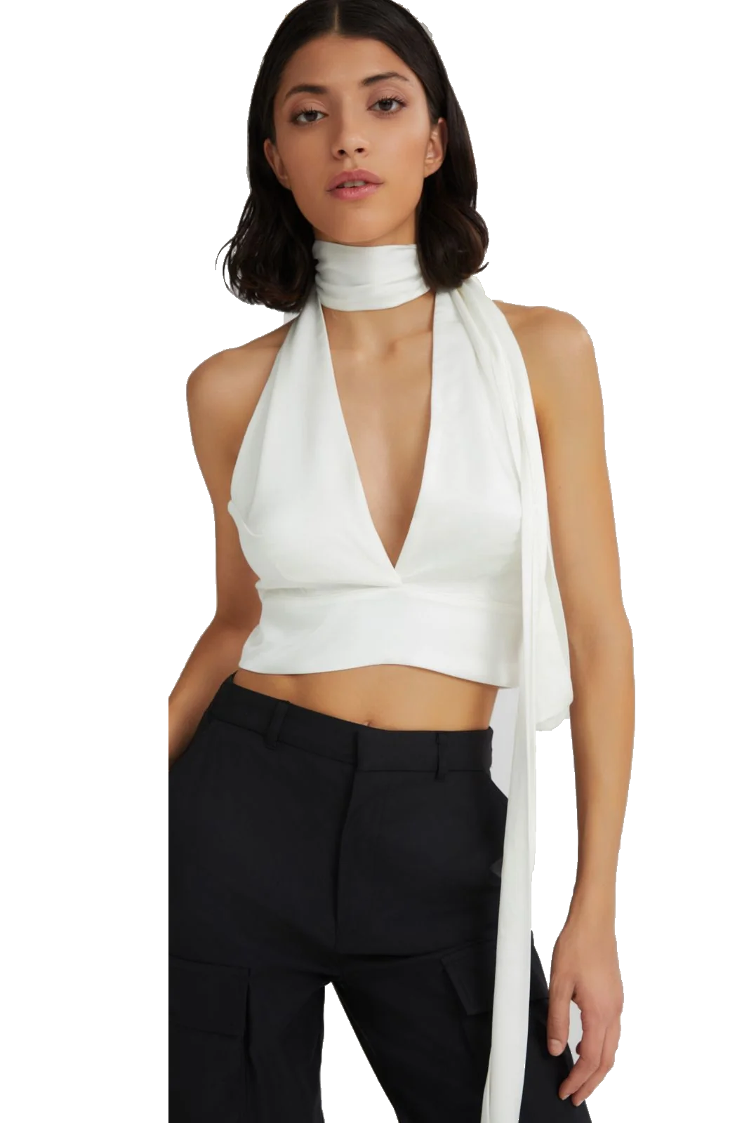 A model wearing a white halter crop top with a deep V-neckline and a matching draped scarf detail, paired with black trousers, against a plain white background.