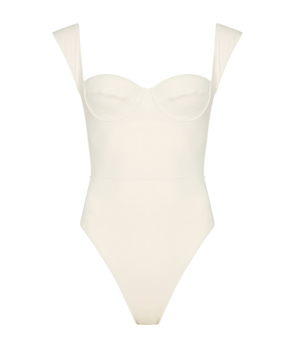White swimsuit with thin straps on a white background