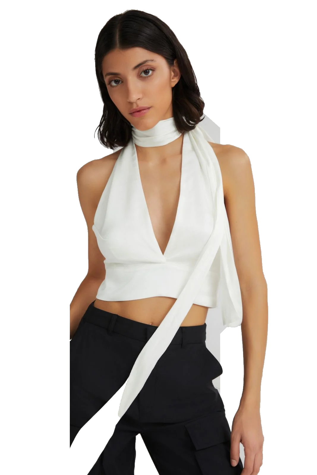 A model wearing a white halter wrap top with a high neck and a long draped tie detail, paired with black pants, against a plain white background.