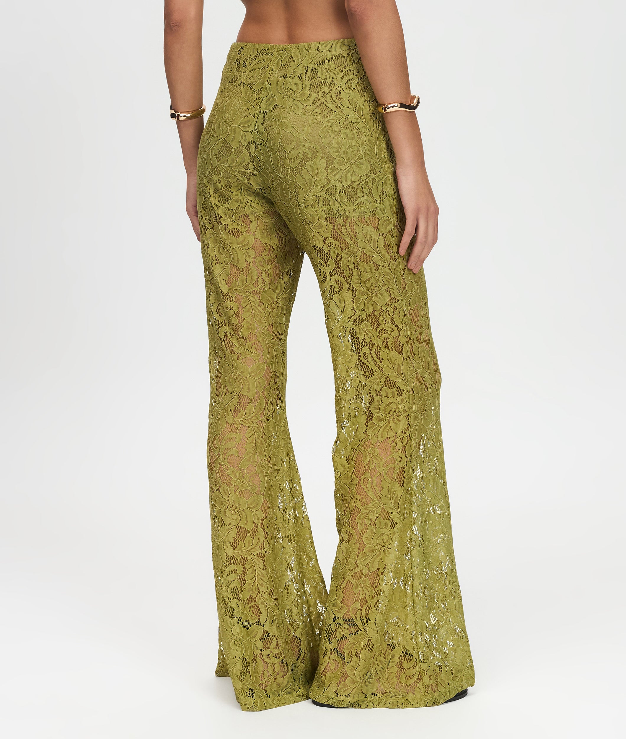 Green lace pants on a white background