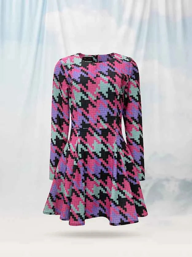 Multicolored patterned dress on a mannequin against a white background