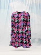 Multicolored patterned dress on a mannequin against a white background