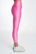 Pink leggings worn by a person on a white background