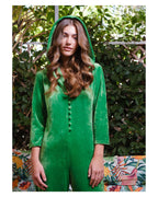 Person wearing a green hooded outfit with a leafy background