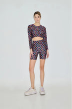 Person wearing a patterned outfit on a white background