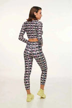 Woman wearing a patterned outfit on a white background