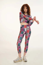 Person wearing a colorful patterned outfit on a white background