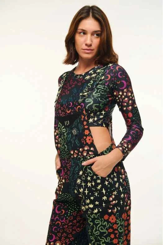 Woman wearing a colorful patterned outfit on a white background