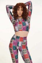 Person wearing a colorful patchwork outfit on a white background