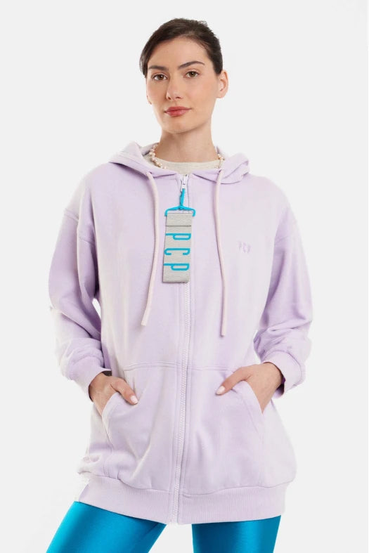 Person wearing a light purple hoodie with a graphic design on a white background