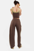 Person wearing a brown outfit with a white background