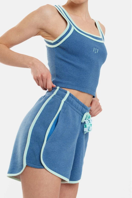 Blue athletic outfit with white trim on a white background