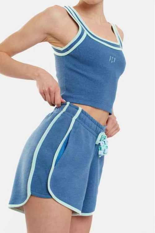 Blue athletic outfit with white trim on a plain background
