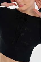 Black crop top with bow detail on a white background
