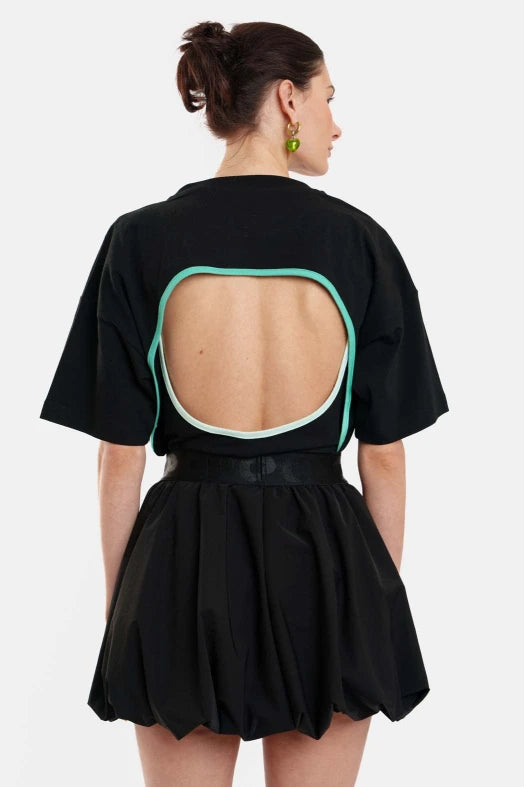 Black dress with open back design on a white background