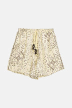 Beige lace top with floral patterns on a white background