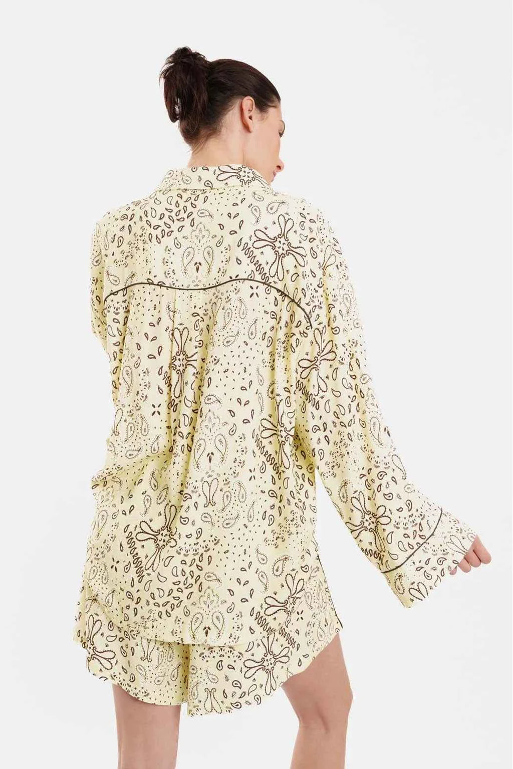 Woman wearing a floral lace dress on a white background